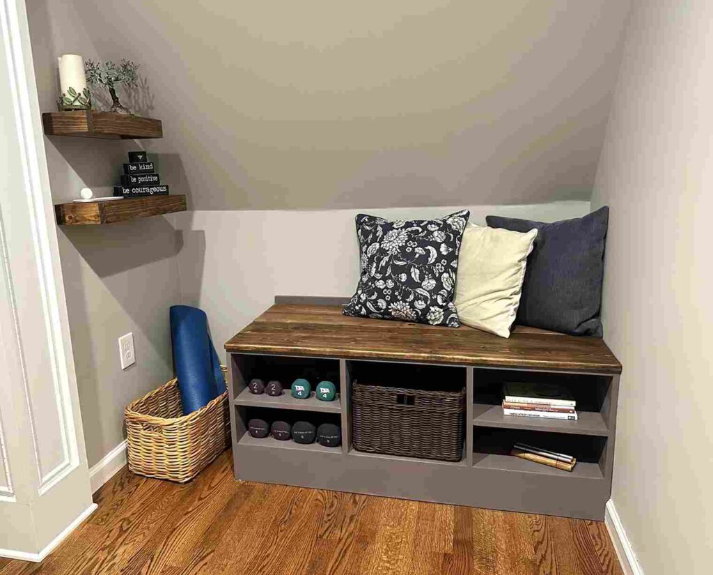 A small corner wooden bench with storage built-in underneath it