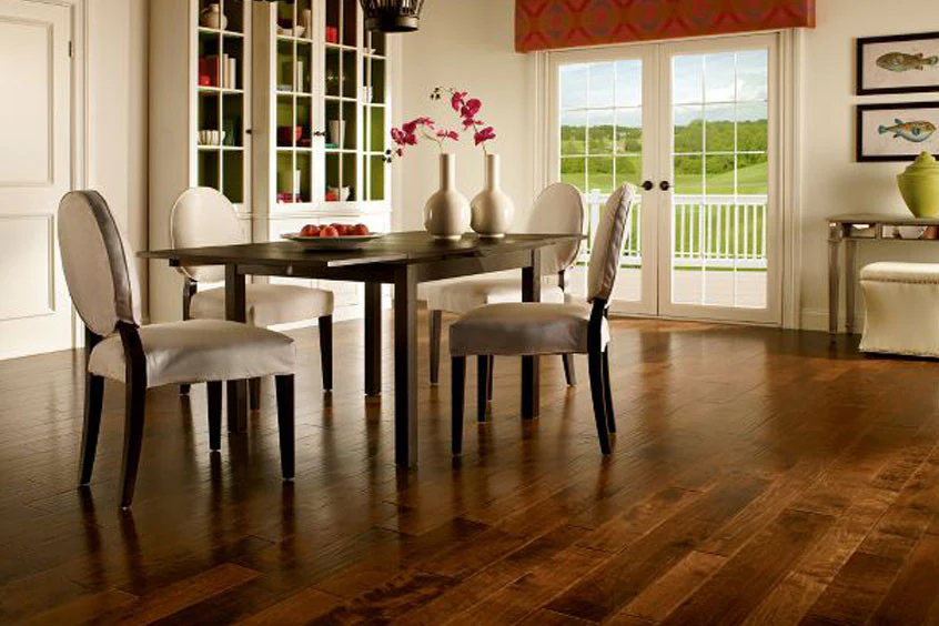 Dark wooden vinyl flooring and cream color chair and wooden dining table