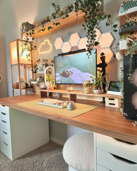 Brown and white wooden cabinet table and a computer set up on it with plants on floating shelves