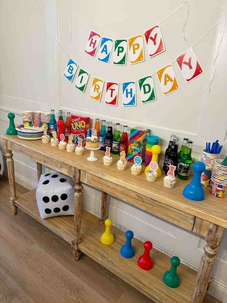 Games and snack set up on wooden table 