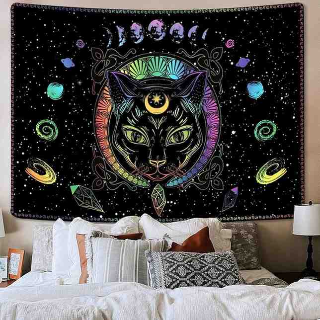 Black galaxy theme tapestry with a cat printed on it