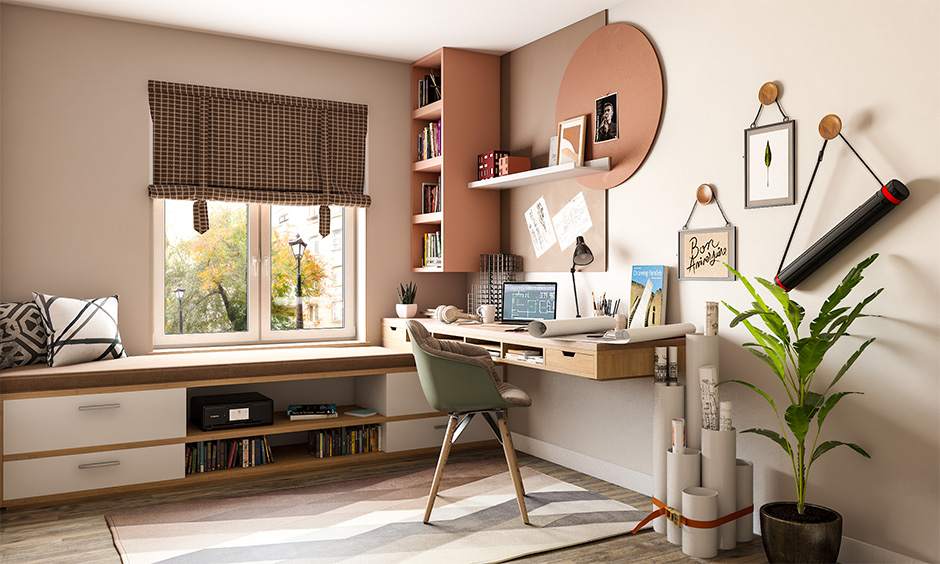 A green wooden chai and a table and a floating cabinet for the book