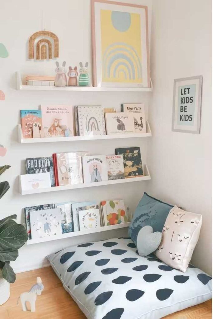 A floor pillow and floating shelves with it on wall for the books