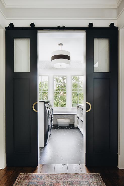 Black double door and white wall for the laundry room