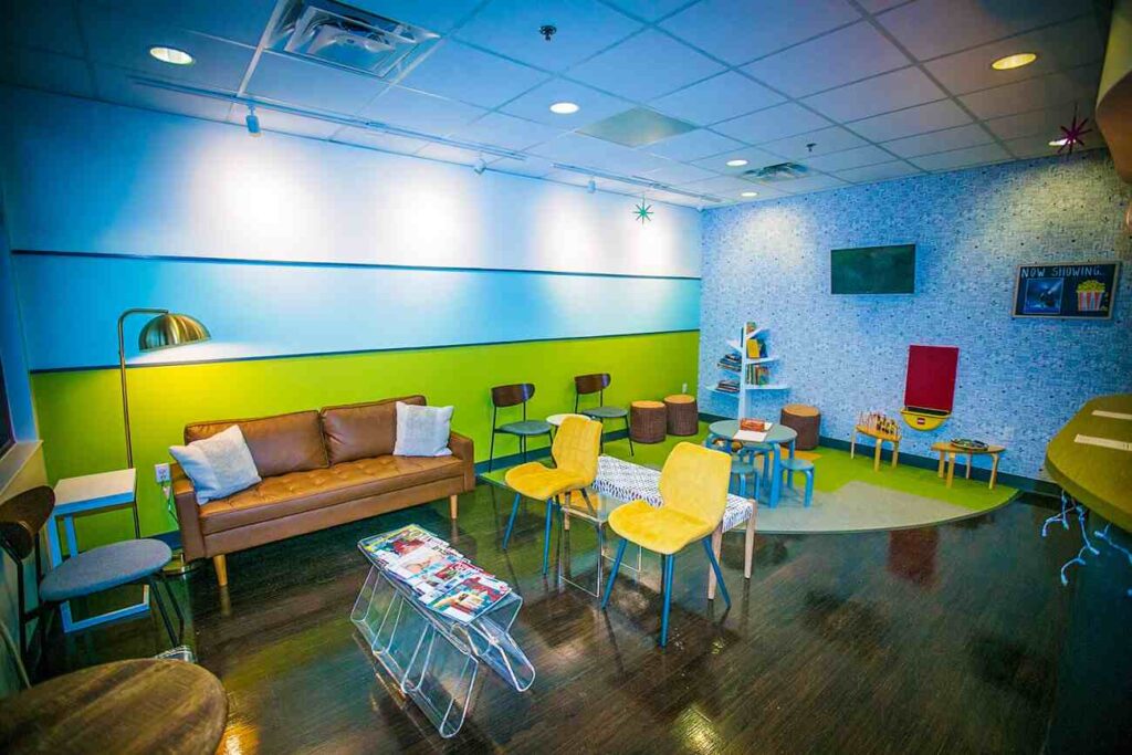 blue and green color wall for seating area in clinic