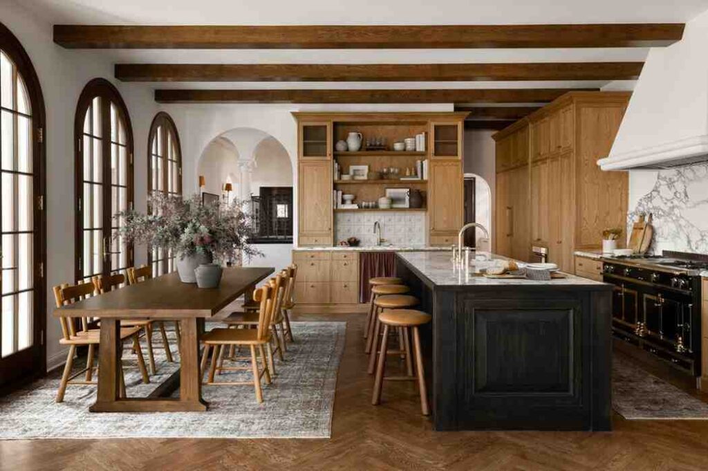 Black kitchen counter and wooden furniture and dining table