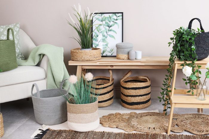 Wooden bench and basket under it and some with plant in the 