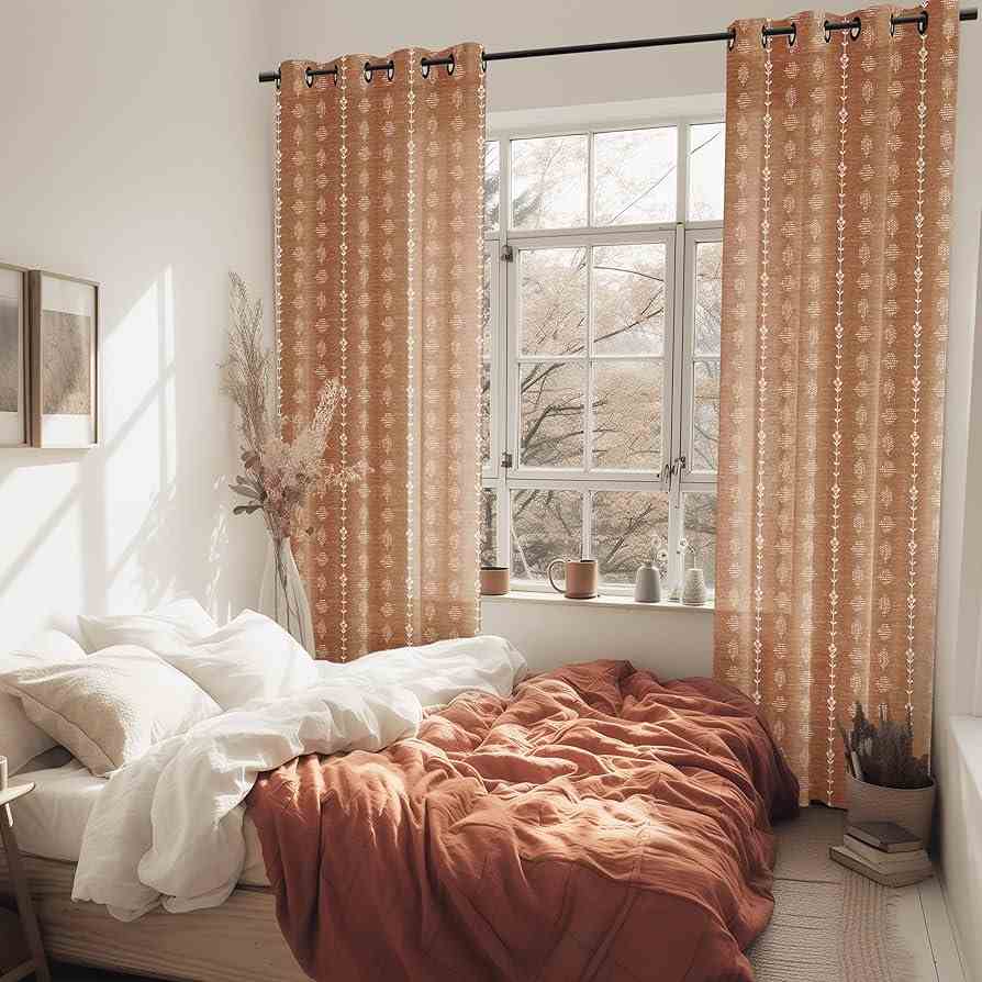 Brown and white sheer curtain and bed with white and brown blanket