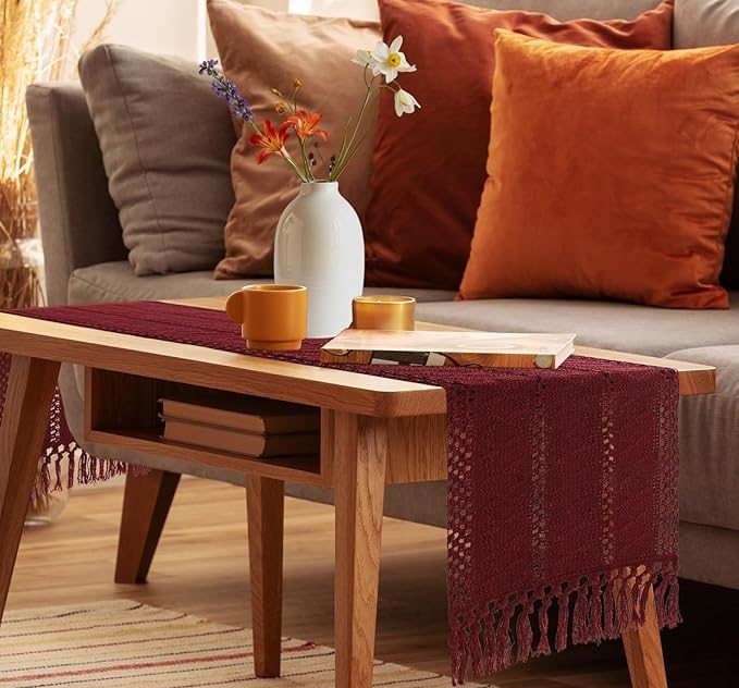 Burgundy crochet table runner on wooden coffee table