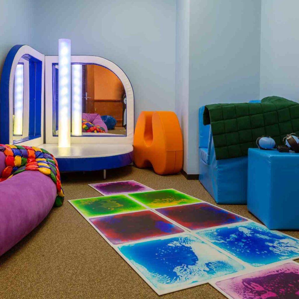 Colorful floor pads on beige carpet and a platform with mirror
