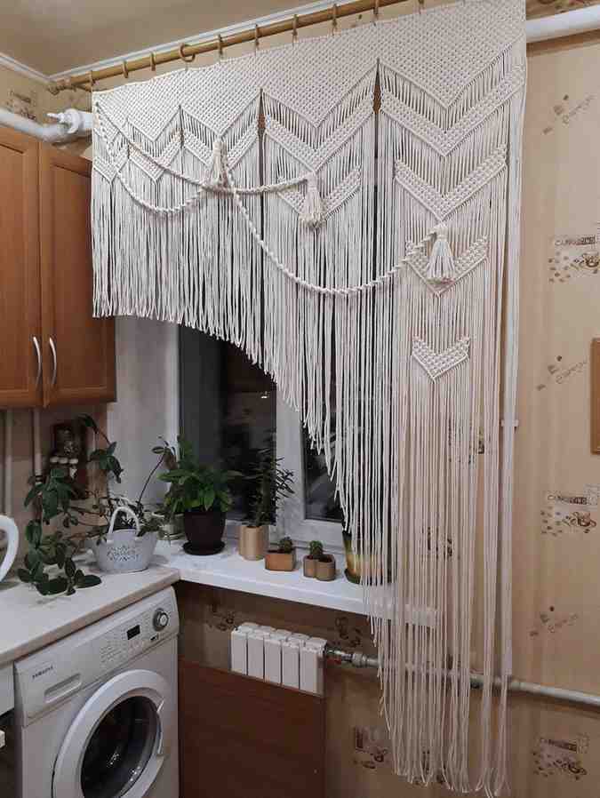 Macrame half curtain hanging from ceiling for the laundry room