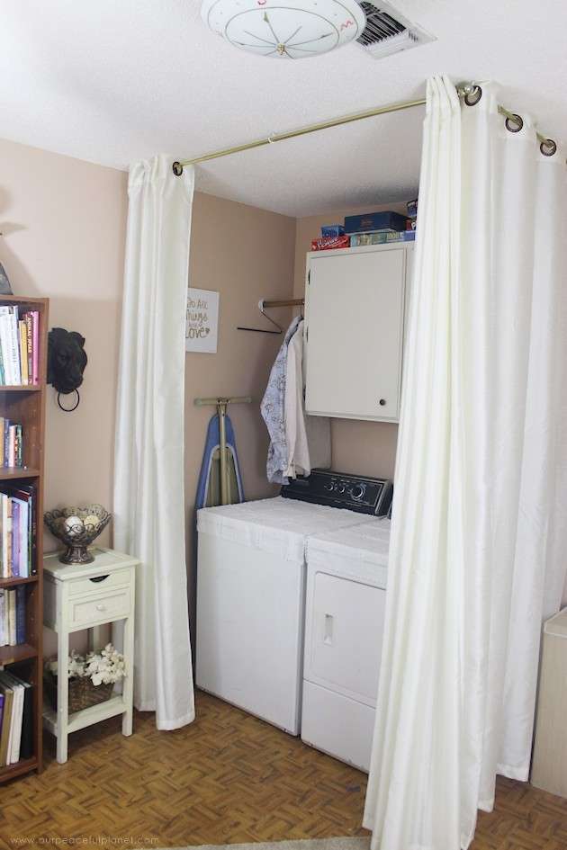White curtains used to create a laundry nook in library room