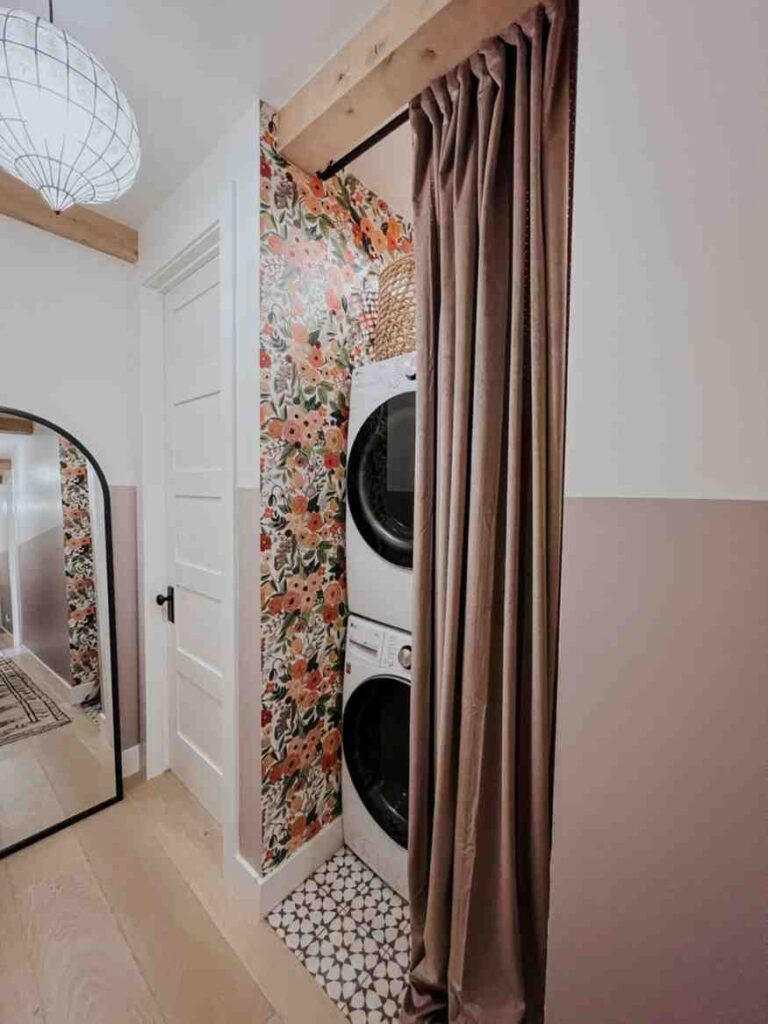 Beige white and floral accent in the laundry room 