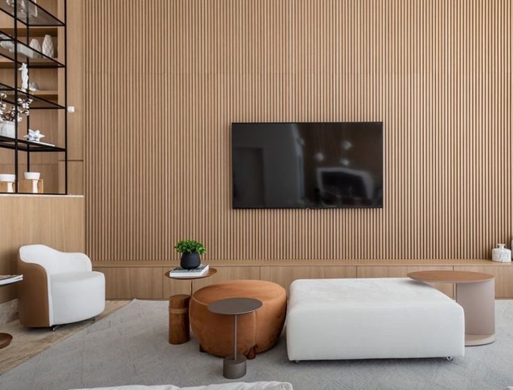 Fluted wooden wall panelling and a TV floating unit