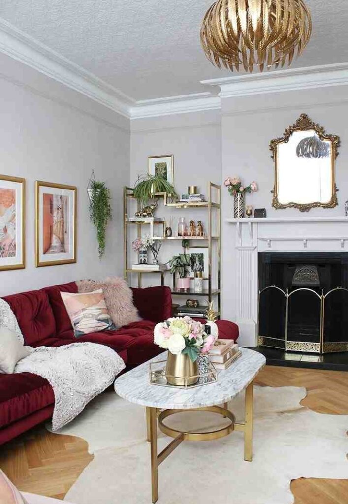 Golden corner cabinet and a ceiling lamp with a coffee table