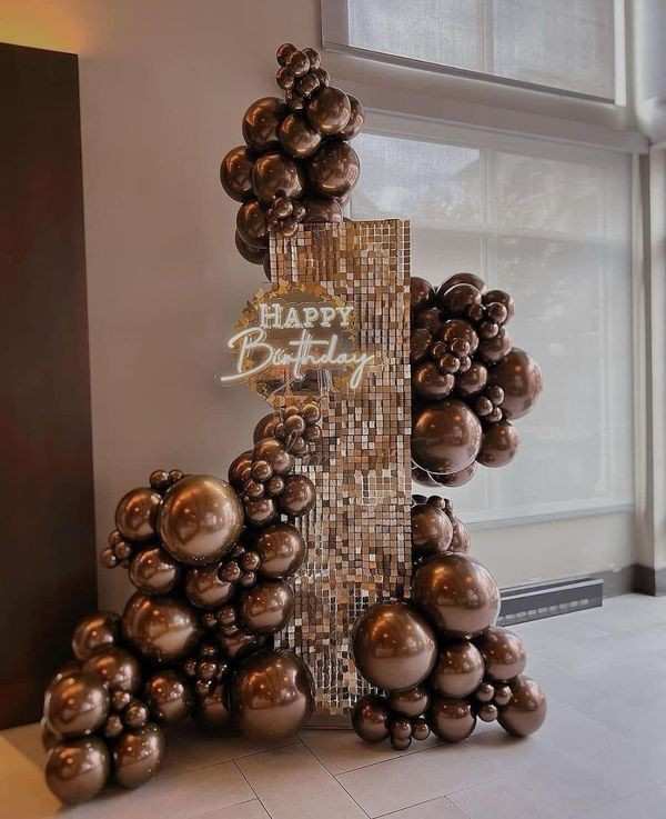 Golden color balloon and shimmer decoration for the birthday 