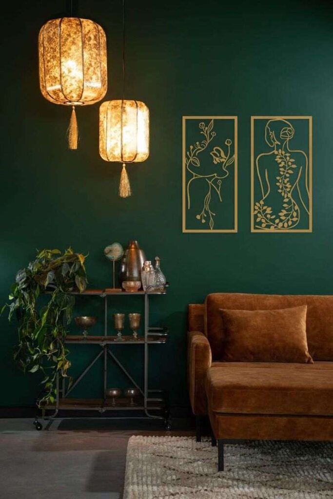 Golden light and abstract art frame on green wall