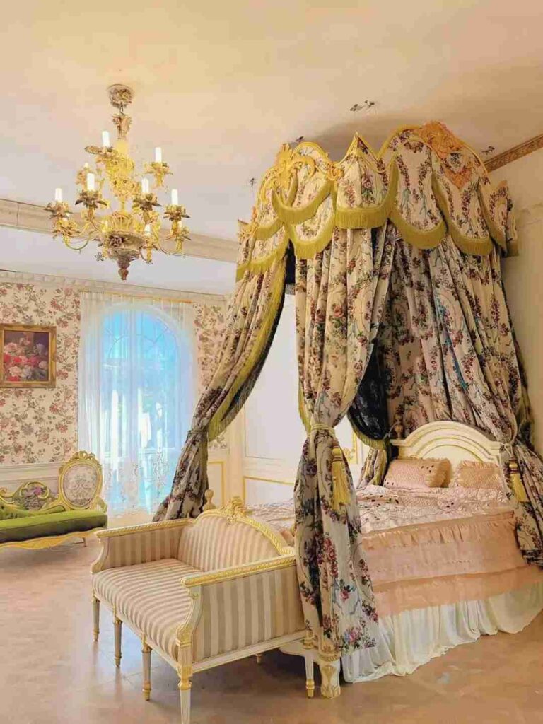 Green and white floral canopy over the bed