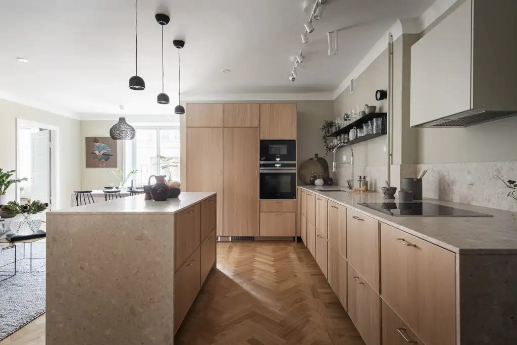 Ork wood kitchen cabinet and flooring with greige white counter top
