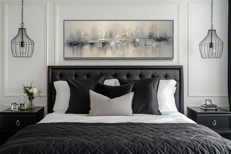 Grey accent black frame art frame above the bed with two cage design lamp
