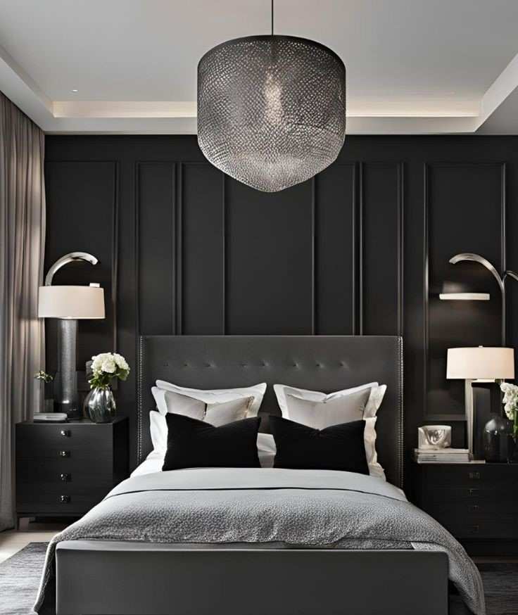 Dark gray metal made ceiling lamp and black wall panelling