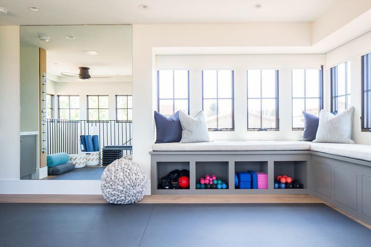 Home yoga room with a bench with storage in blue color