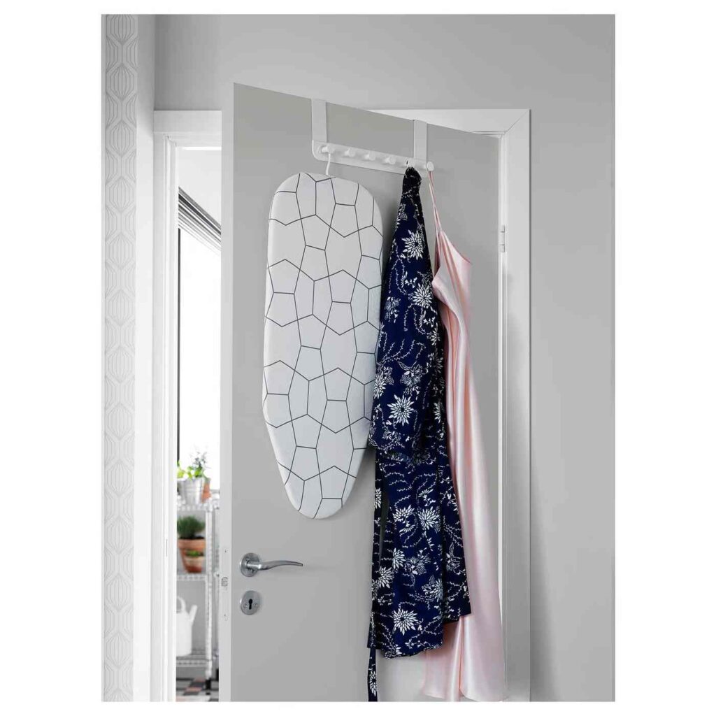 Ironing hanging board on door frame and other clothes too