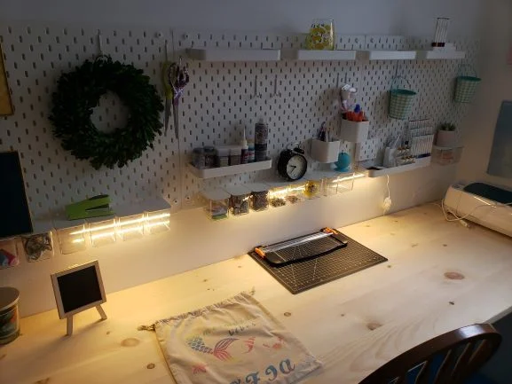 White pegboard and led lights under it for the sewing room