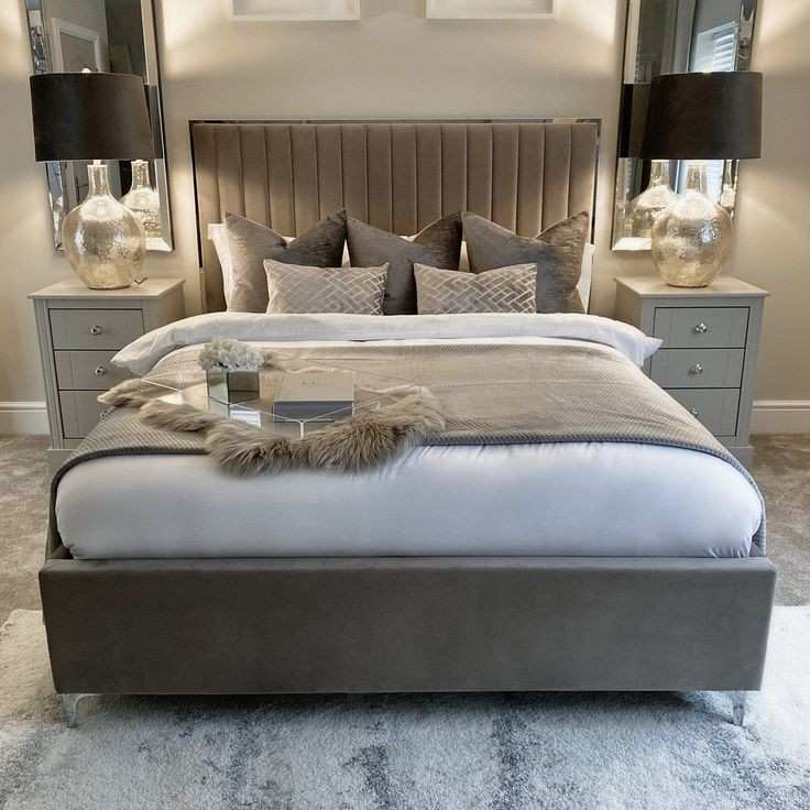 Metallic accent bedside lamp and a tray on the bed