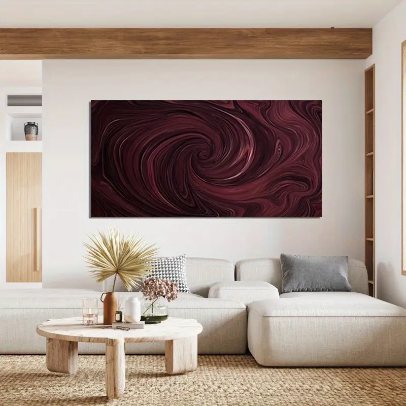 Cream sofa set and a wooden coffee table and a burgundy art frame above it