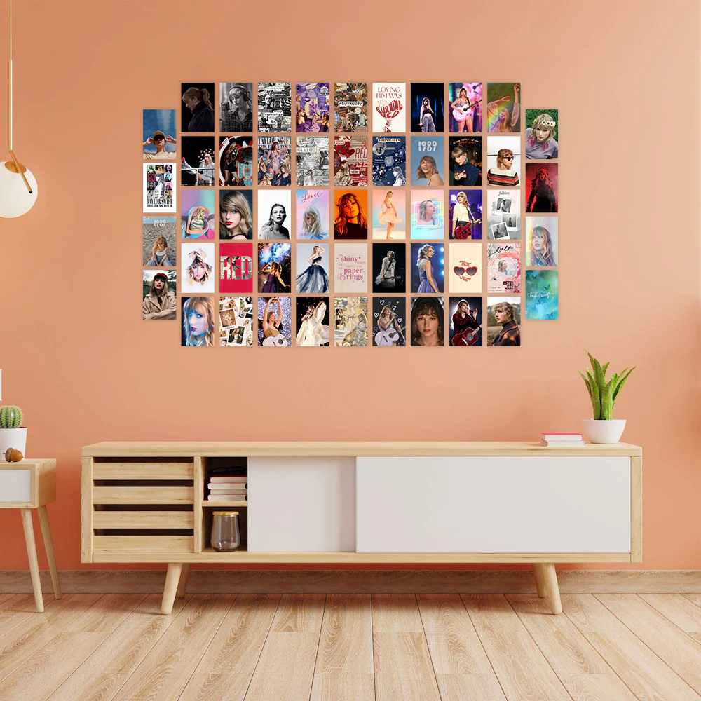 Pink wall and a wooden console table with poster on wall