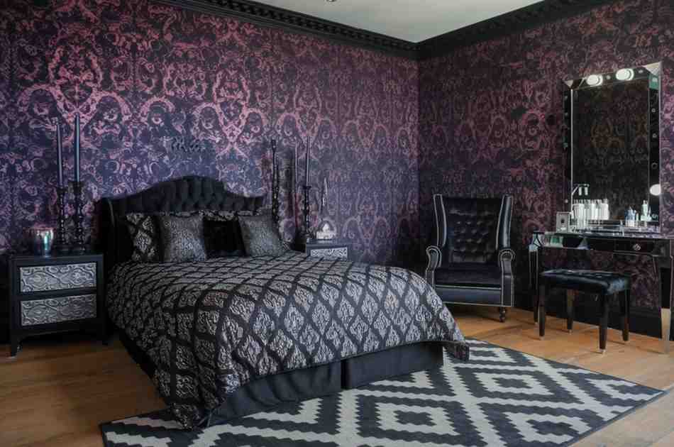 Black furniture and purple gothic wallpaper for the gothic theme room