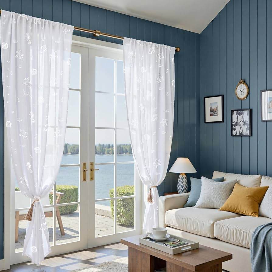 Blue wooden wall panelling and white sofa with sheer curtains on door 