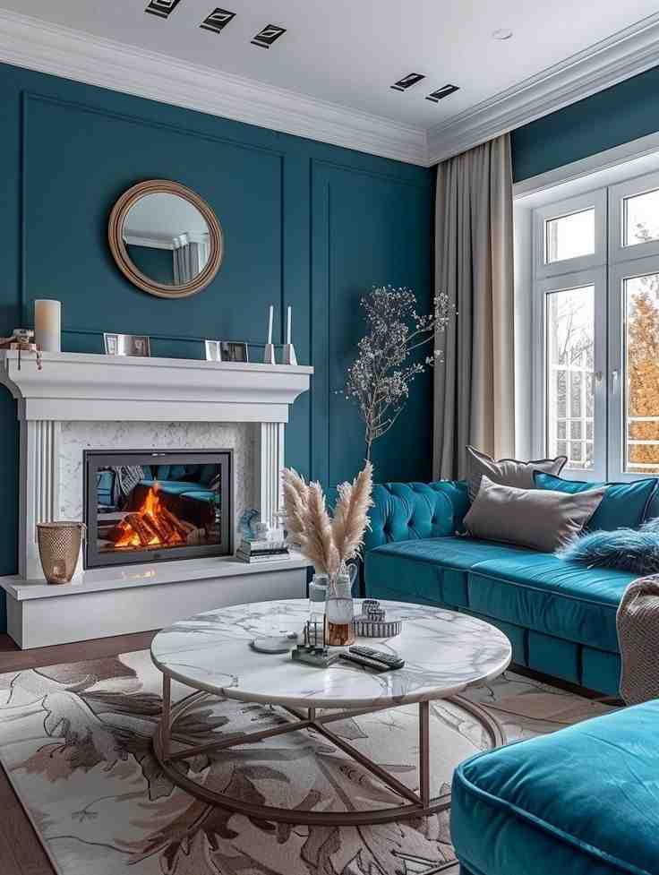 Silver coffee table frame with a white table top and a fireplace and a mirror hanging above it