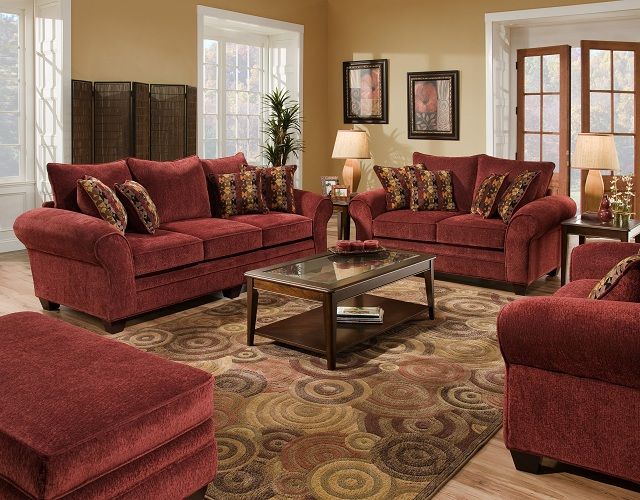 Three toned carpet under the burgundy sofa