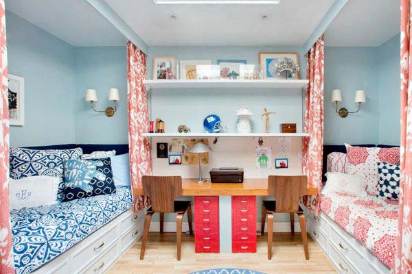 Two bed and curtains hanging from ceiling in two pattern