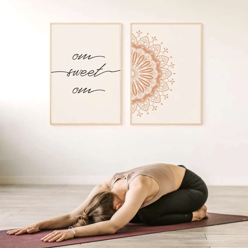 Two wooden quote frames on wall and a girl doing yoga on mat