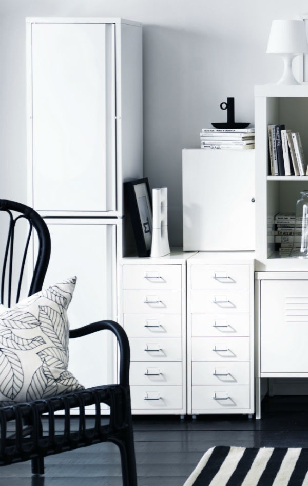Two white Helmer cabinet drawer and a black wooden chair