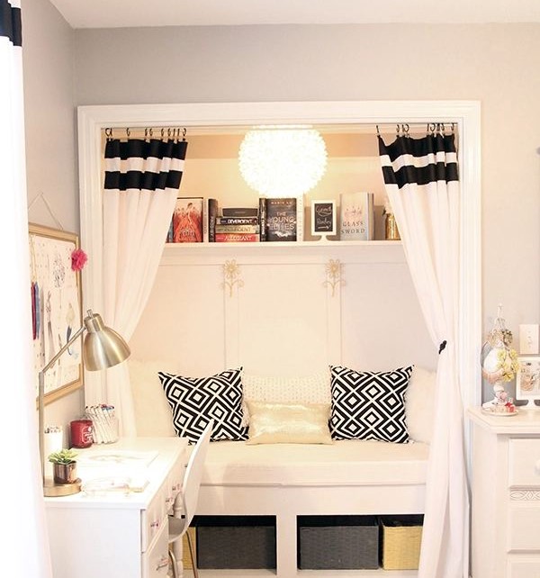 A yellow lamp and a white color curtains for the reading area