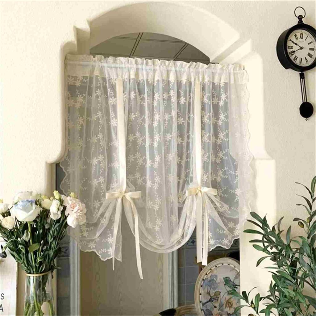 White lace sheer curtains on door with two bow design