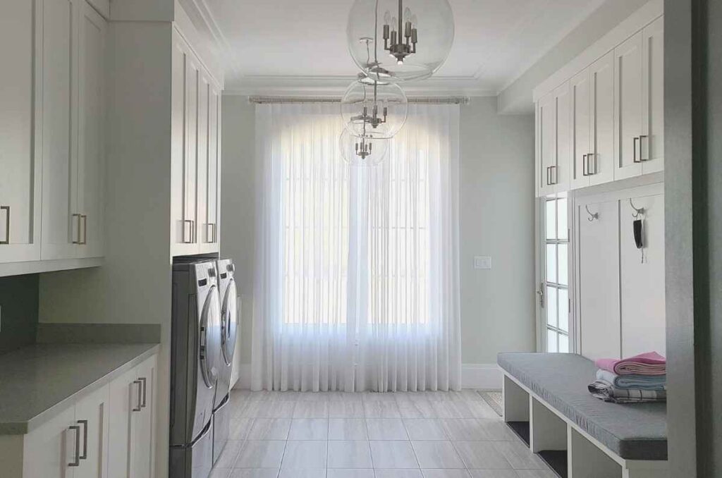 White sheer curtain in laundry room