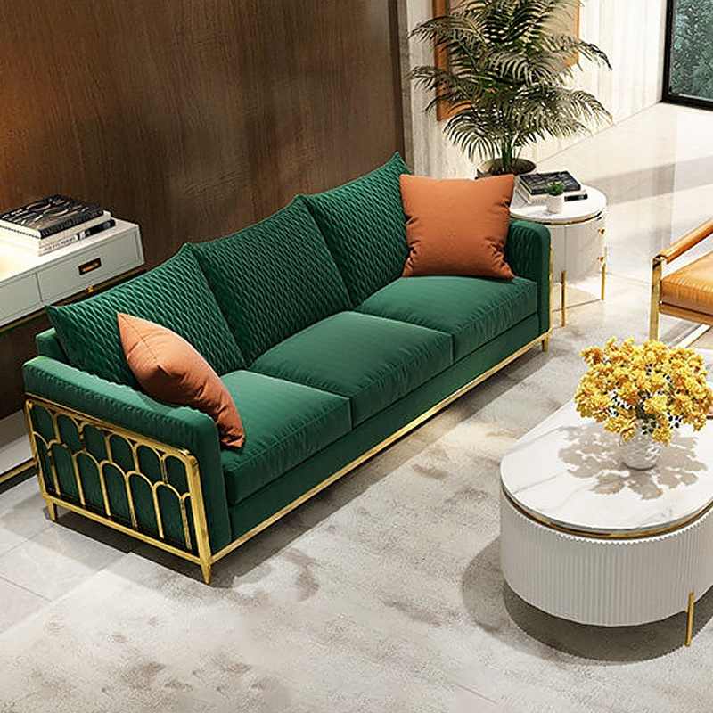 Golden frame and green sofa with a white table with fluted design