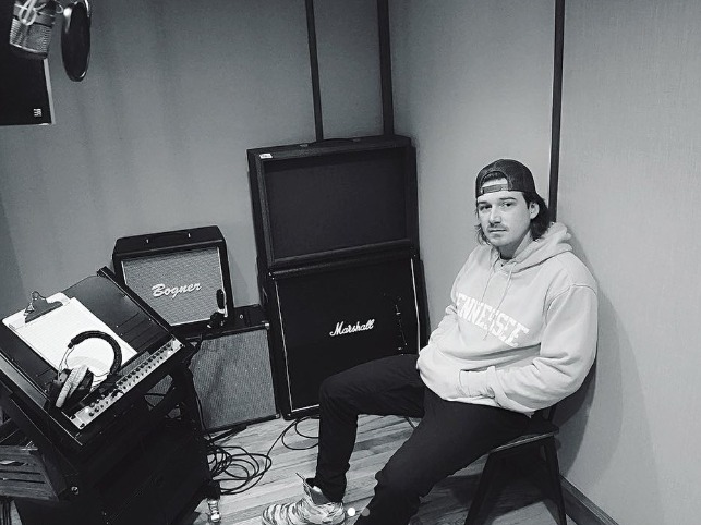 Black and white pic of Morgan Wallen in his music studio 
