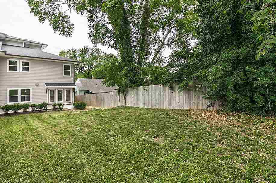 Fencing around the garden area and trees around the house