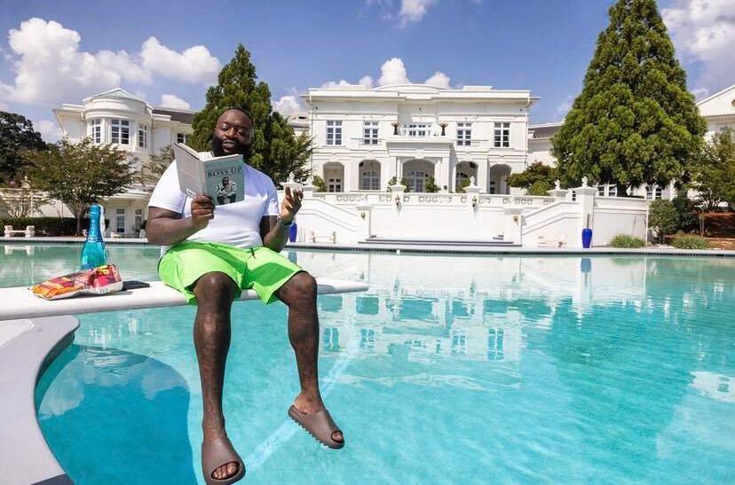 Rick Ross seating on diving board