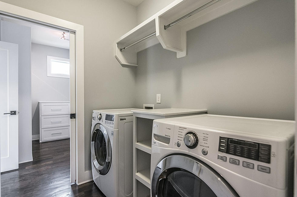 Laundry room with two washing machine in white color 