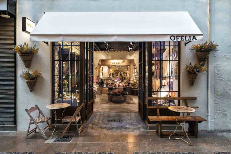 an image showing beautiful cozy store with black door