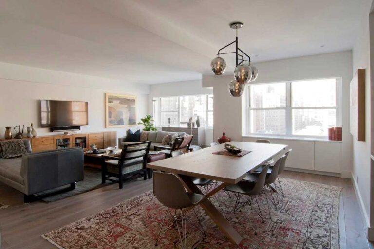 How to Keep Your Home Reliable, Safe, and Ready for Anything living-space-with-large-gray-sofa-coffee-table-and-wood-armchair