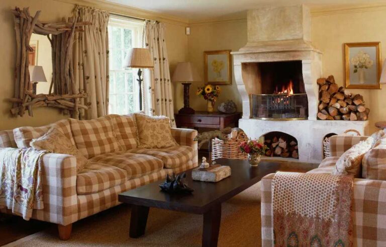cozy-living-room-and-room-has-soft-yellow-walls-framed-pictures-table-lamps-and-basket-near-fireplace-and-sofa-with-cushions