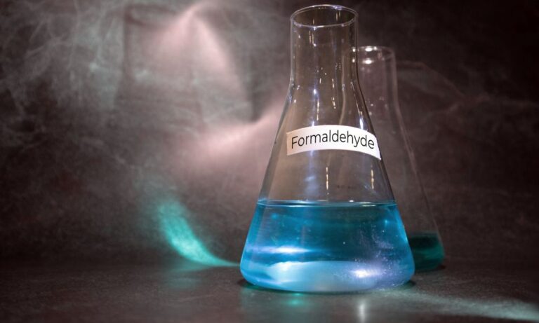 two-laboratory-flasks-both-containing-a-blue-liquid